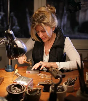 Heather at the jeweler's bench, hand-forging